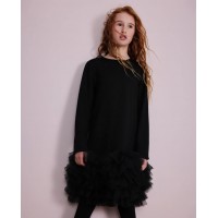 Girls knitted dress with ruffles at the hem and long sleeves Girls knitted dress with ruffles at the hem and long sleeves
